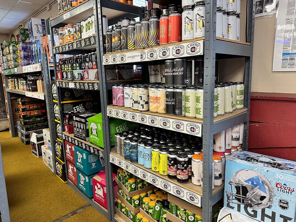 Shown: Many shelves filled with dozens of craft, import and micro brews at Beverage Shop Beer Distributor.